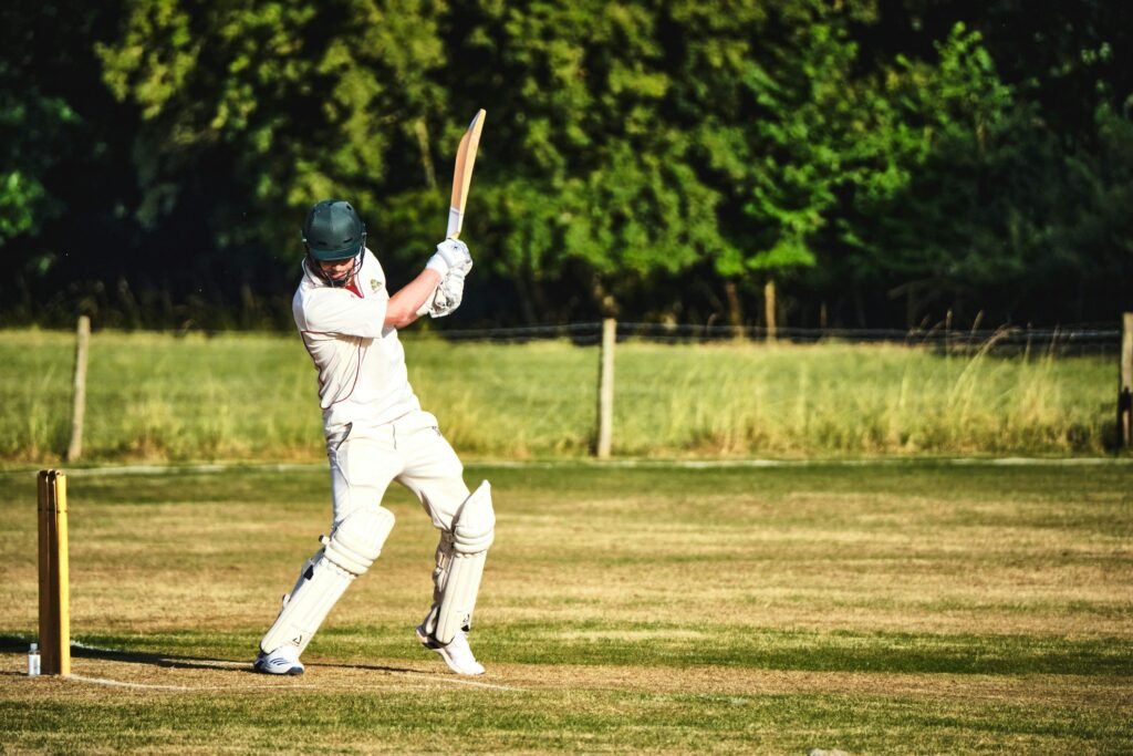 cricket player playing cover drive shot for four in match